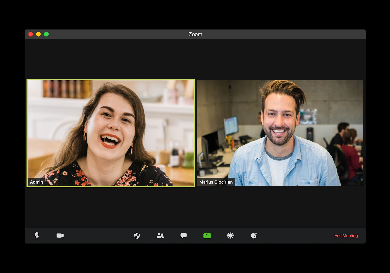 Two people smiling on a video call