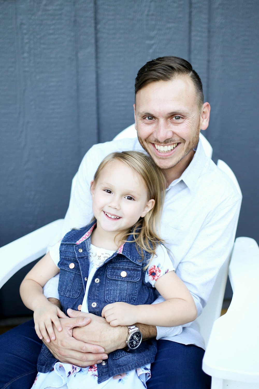 man in white dress shirt beside girl in blue dress shirt