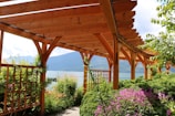 brown wooden bridge over body of water during daytime