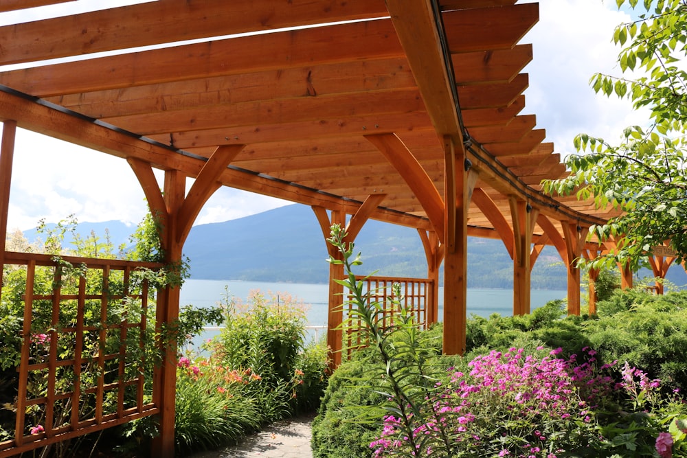 brown wooden bridge over body of water during daytime