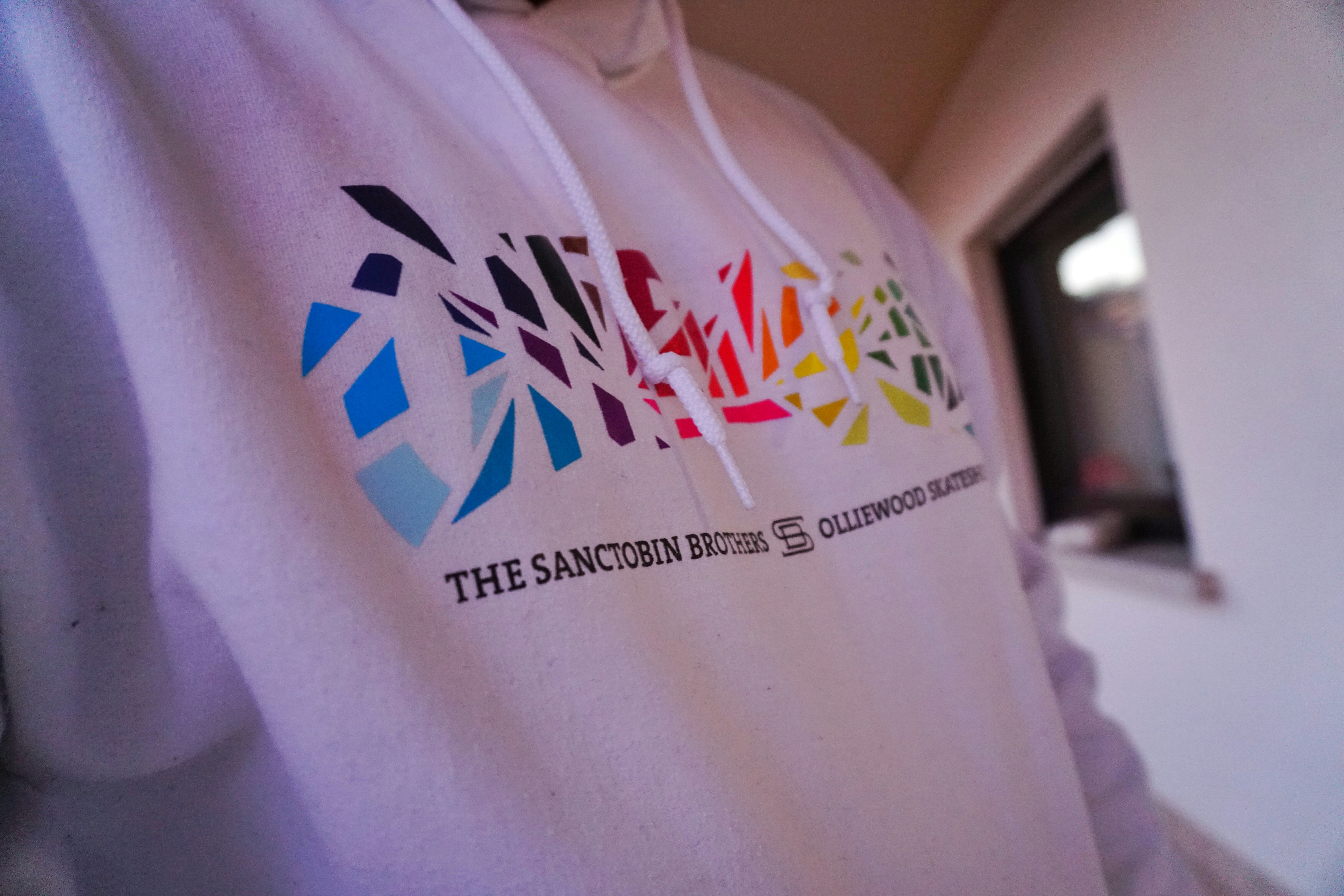 Custom printed hoodie sweatshirt with bold graphic design, bright product photography