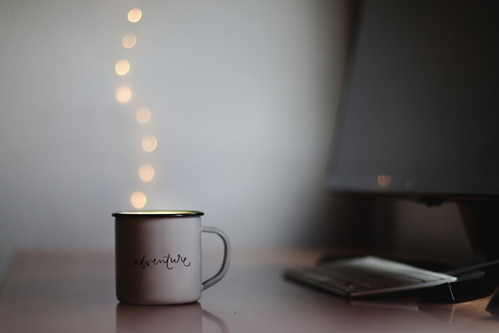 white ceramic mug on table