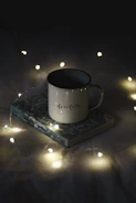 white ceramic mug on blue and white coaster