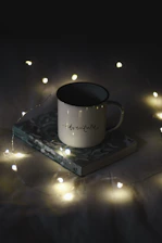 white ceramic mug on blue and white coaster