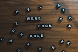 a wooden table topped with scrabbled letters