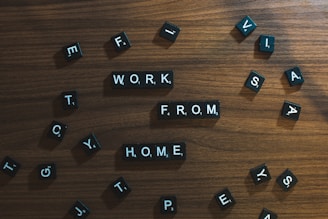a wooden table topped with scrabbled letters