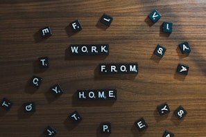 a wooden table topped with scrabbled letters