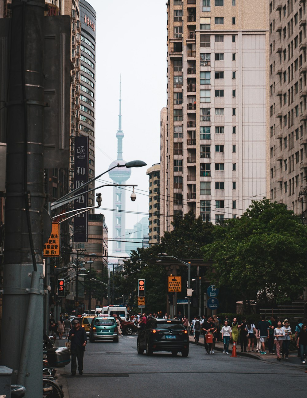 cars on road near buildings during daytime