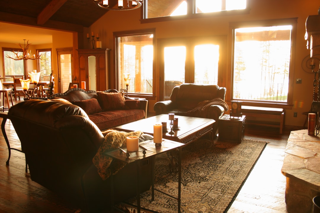 brown sofa near white coffee table