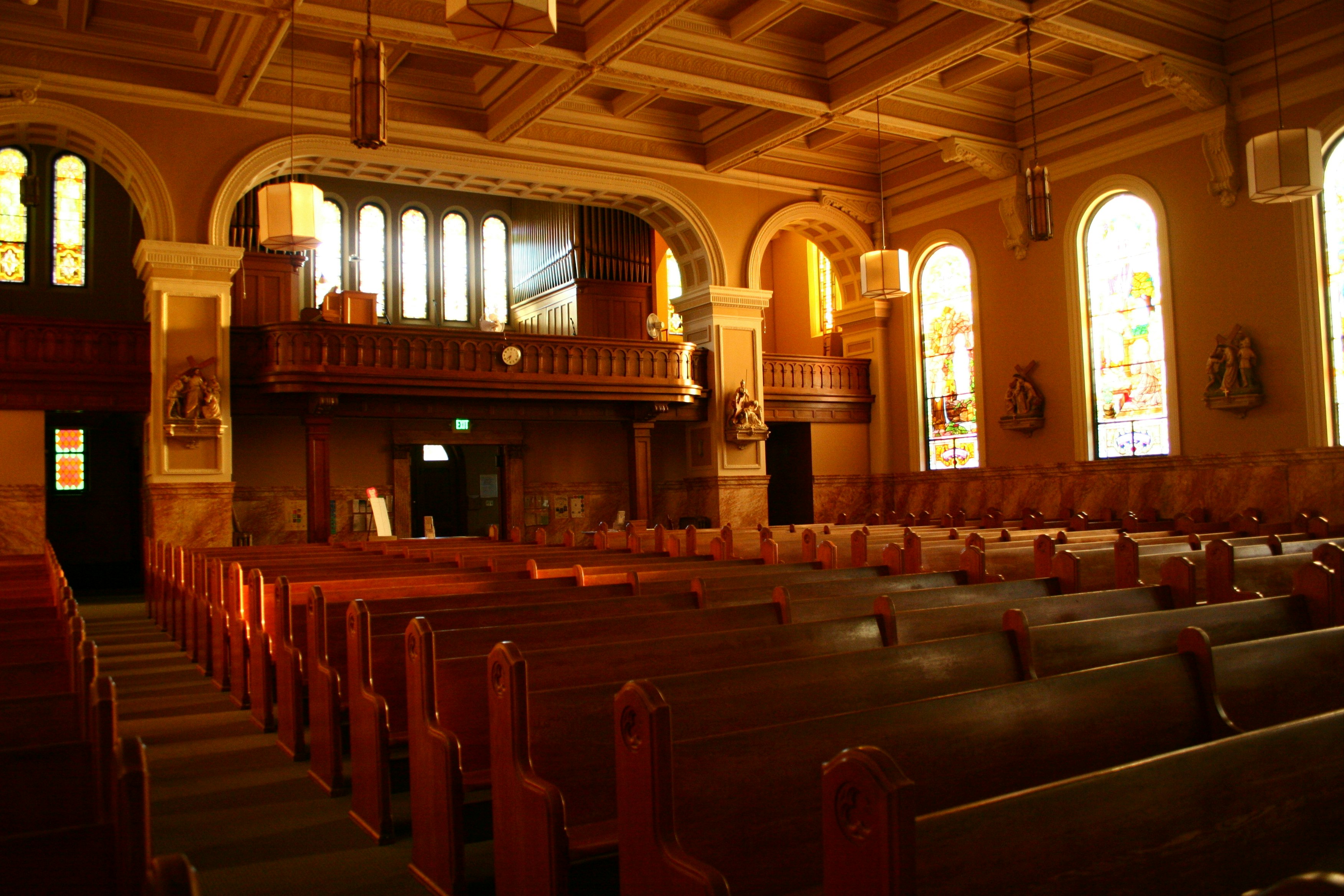 brown wooden chairs inside church