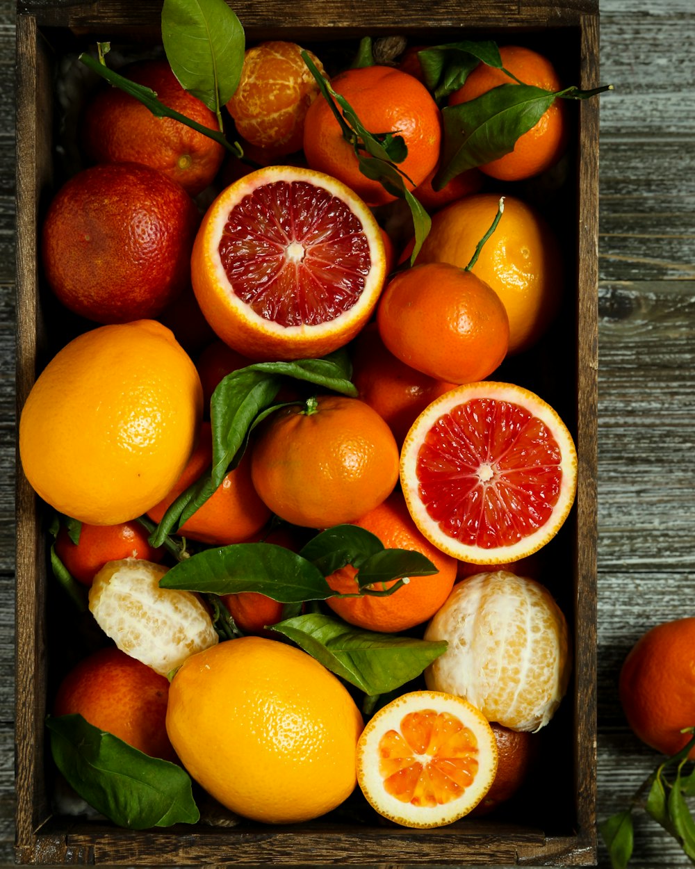 orange fruits on brown wooden table