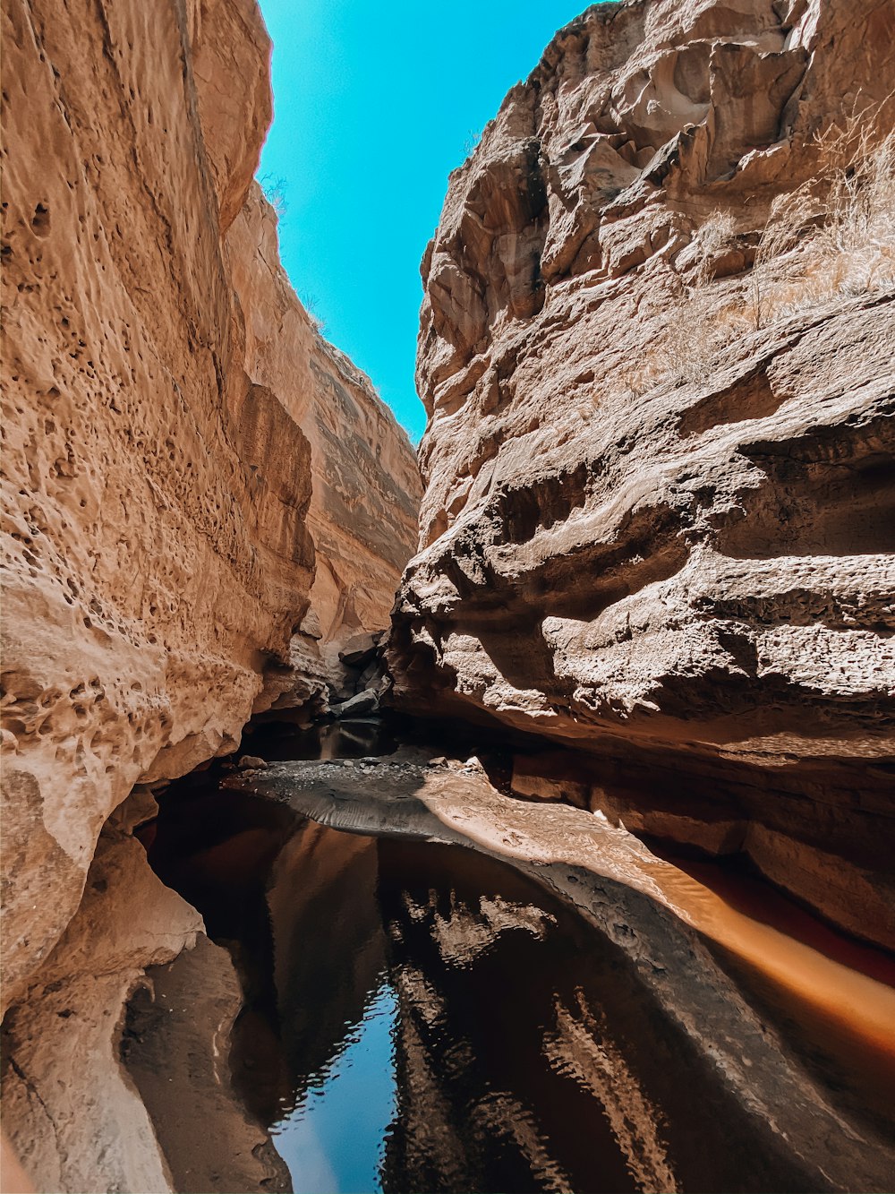 brown rocky mountain under blue sky during daytime