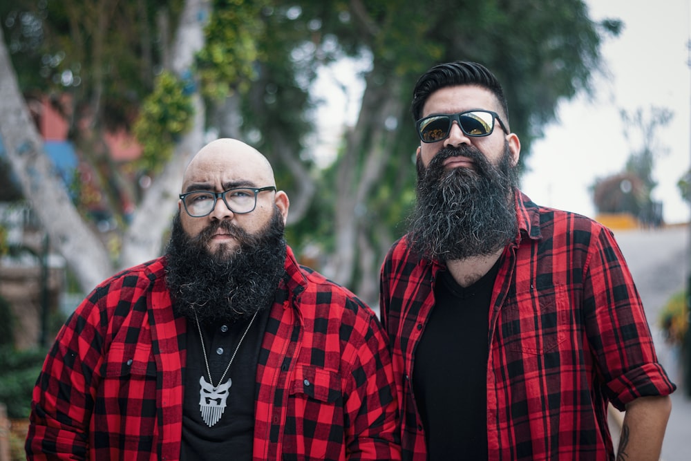 man in red and black plaid dress shirt wearing black framed eyeglasses