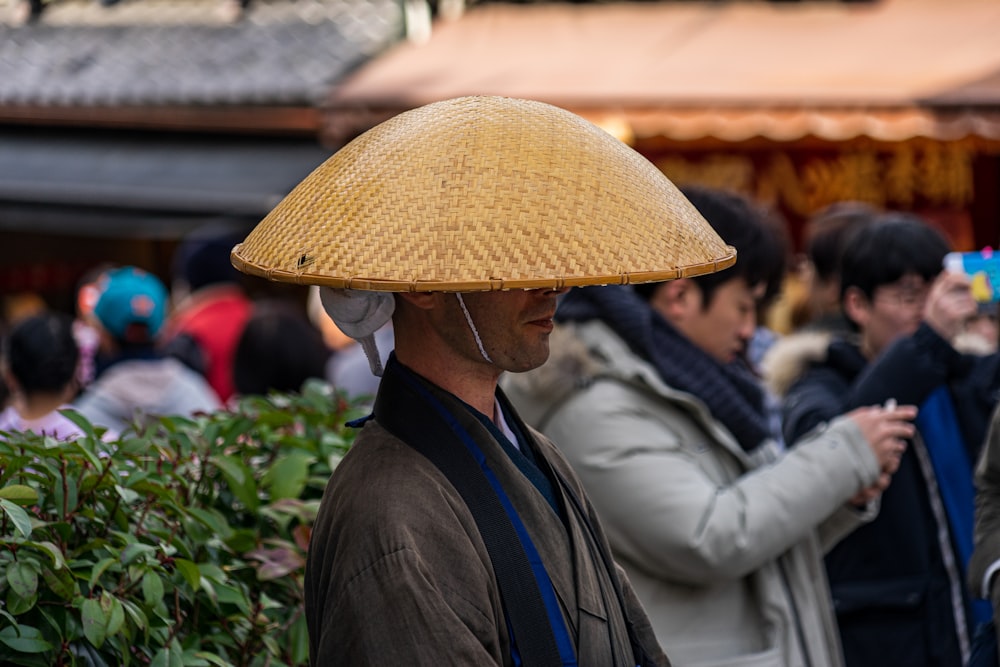 man in brown hat and black jacket