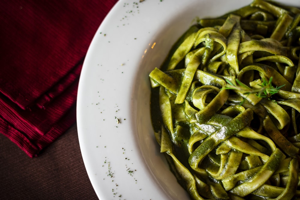 green vegetable on white ceramic plate