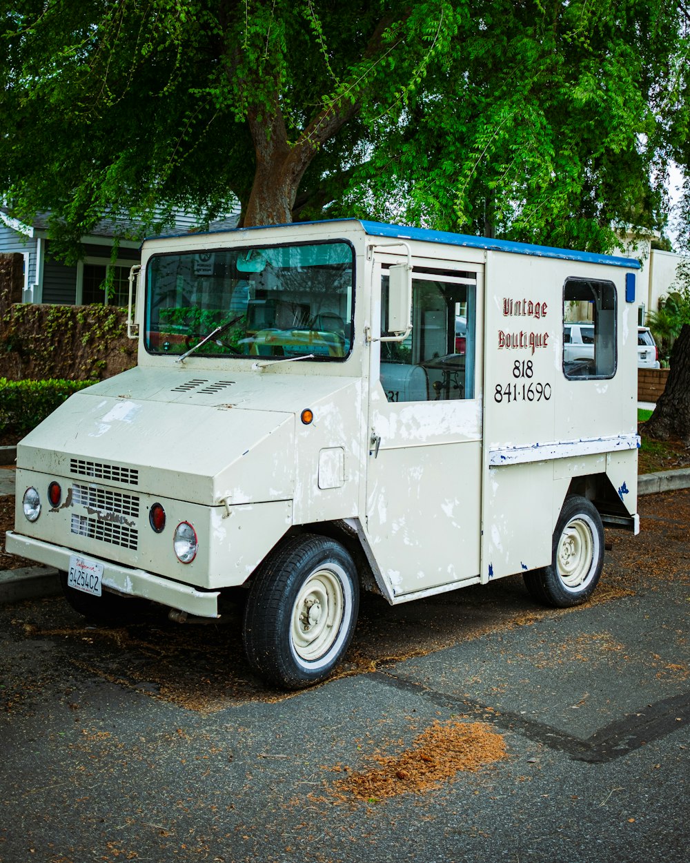 white and blue van on road during daytime