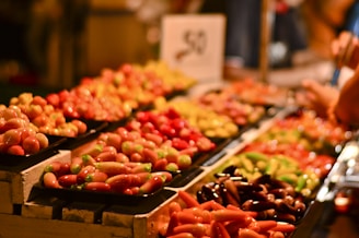 red and green fruit on brown wooden tray