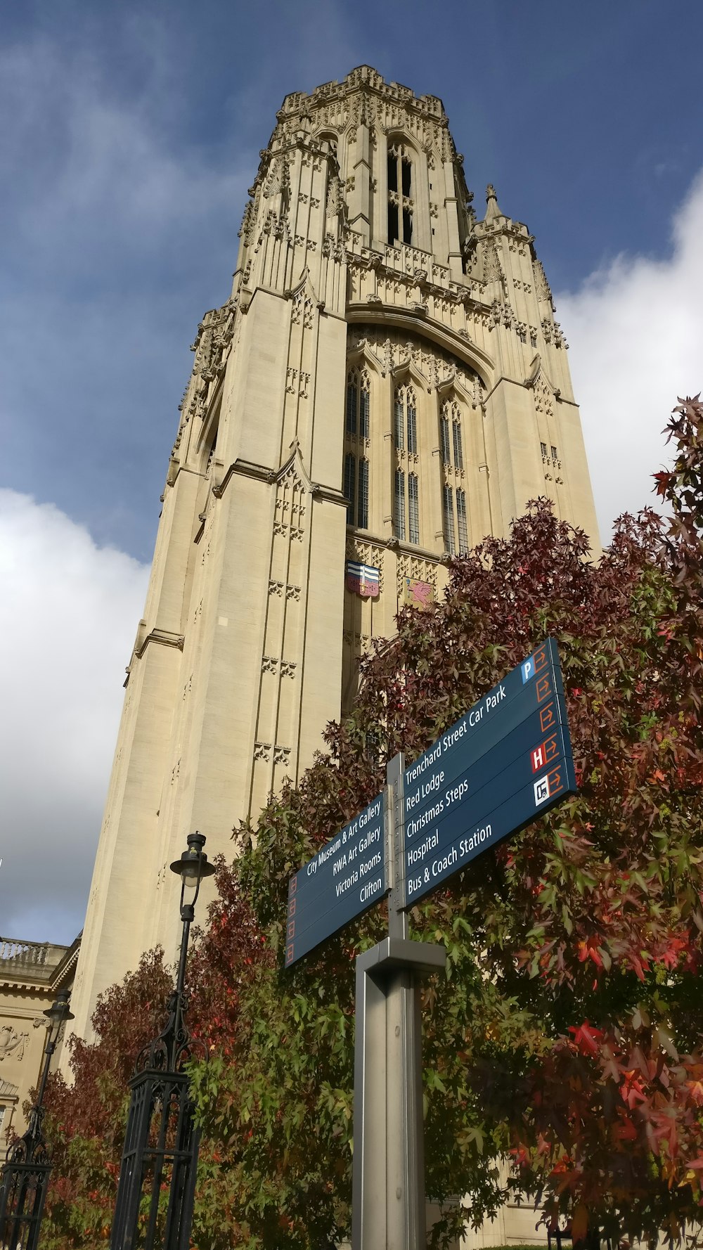 brown concrete building with blue and white signage