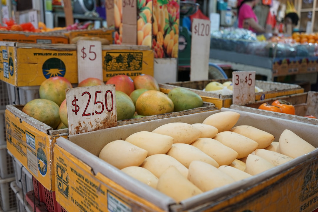 yellow and green apples on brown wooden crate,