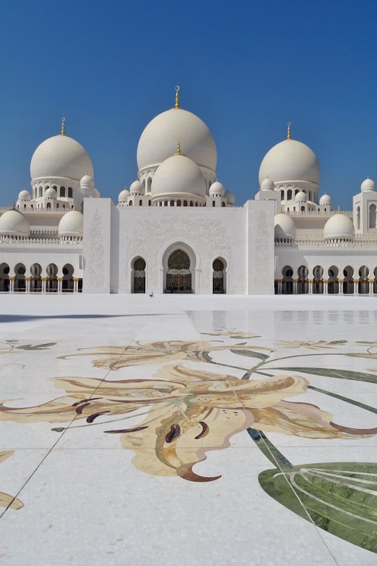 white and gold dome building in Sheikh Zayed Mosque United Arab Emirates