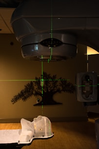 black pendant lamp turned on near white wall