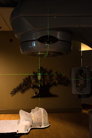 black pendant lamp turned on near white wall