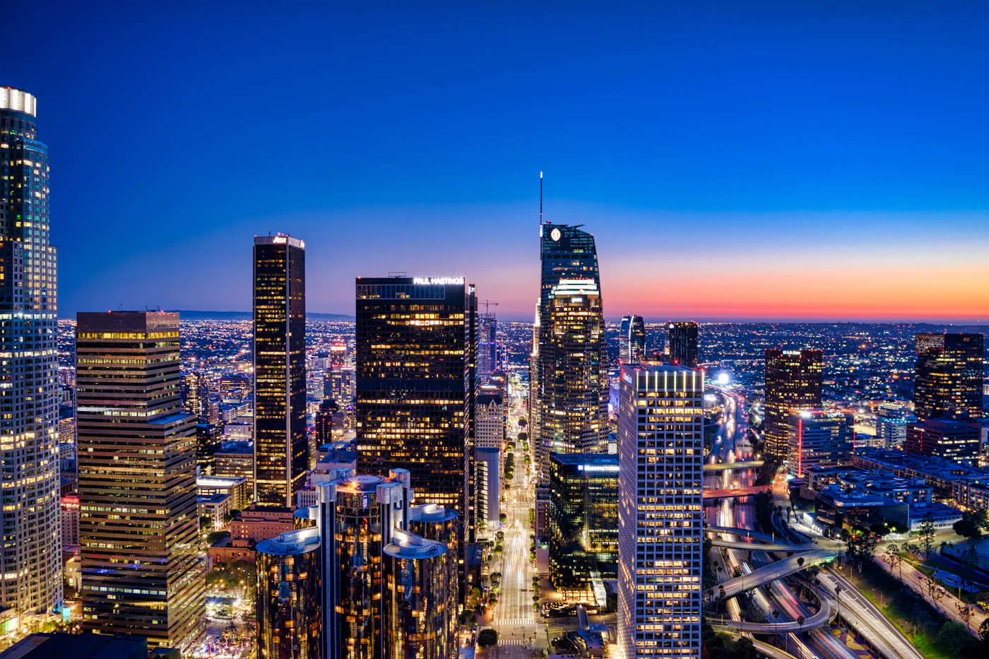 Downtown Los Angeles skyline illuminated at blue hour
