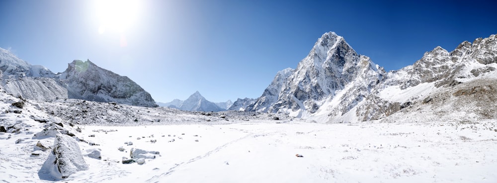 snow covered mountain under blue sky during daytime