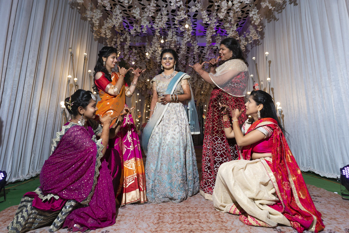 Indian wedding celebration with friends and family enjoying a joyful Sangeet ceremony