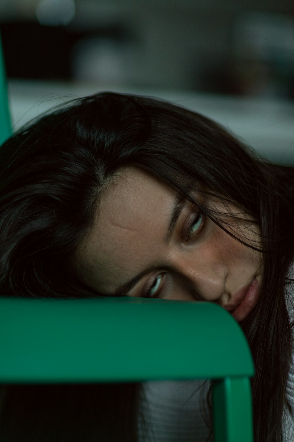 woman lying on green textile