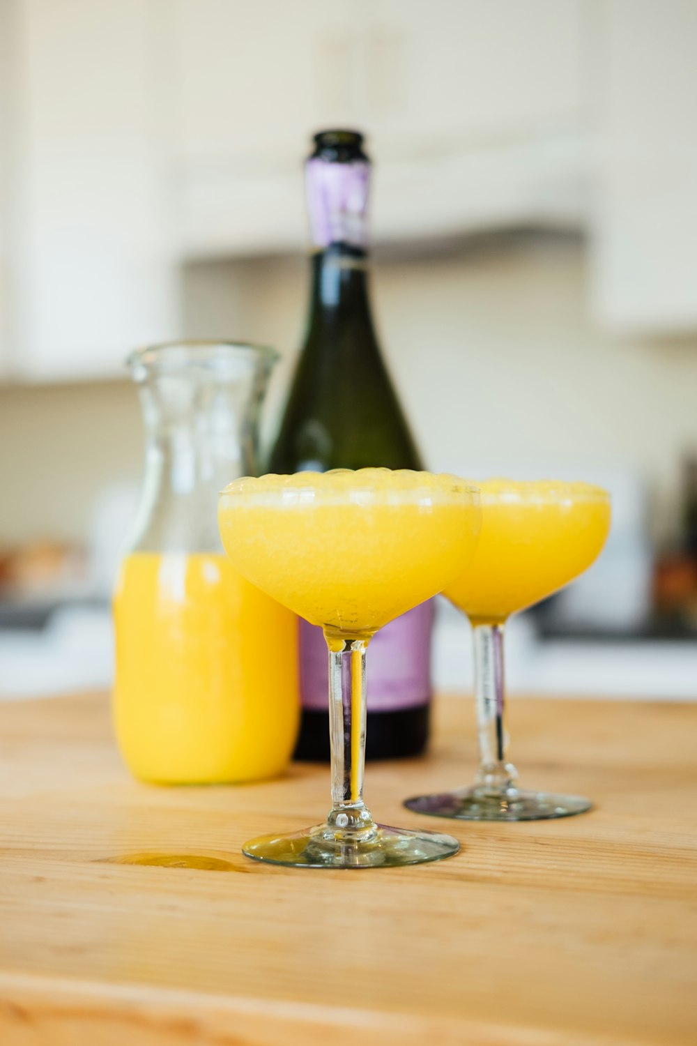 yellow liquid in clear drinking glass