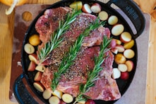 cooked meat on black plate