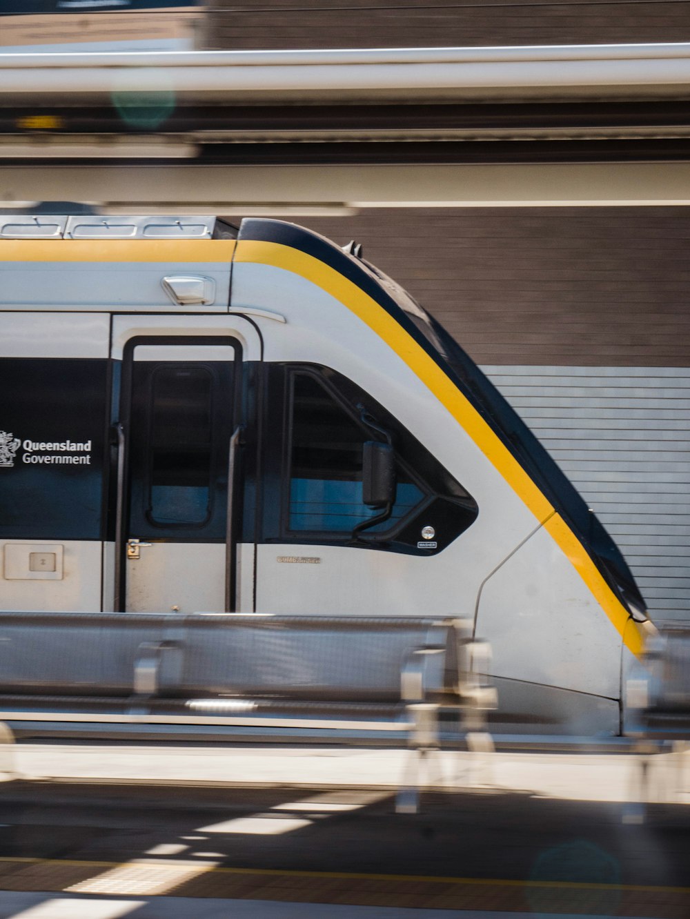 white and blue train in train station