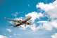 white airplane under blue sky during daytime