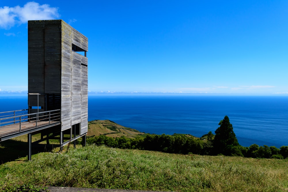 gray concrete building near body of water during daytime