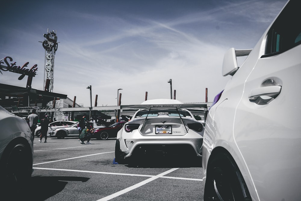 a group of cars parked in a parking lot