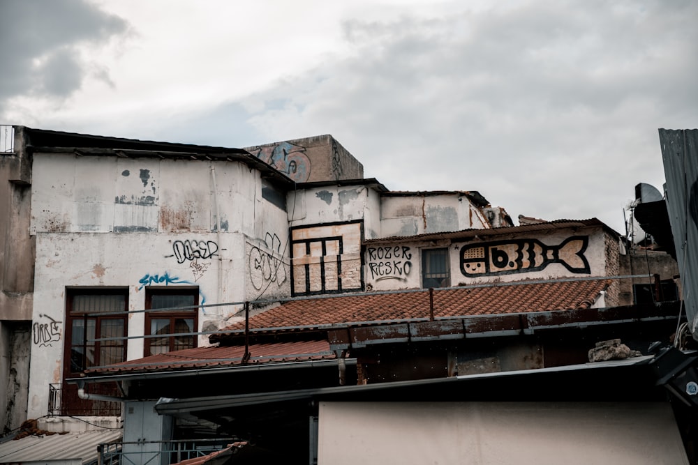 white and brown concrete building under white clouds during daytime