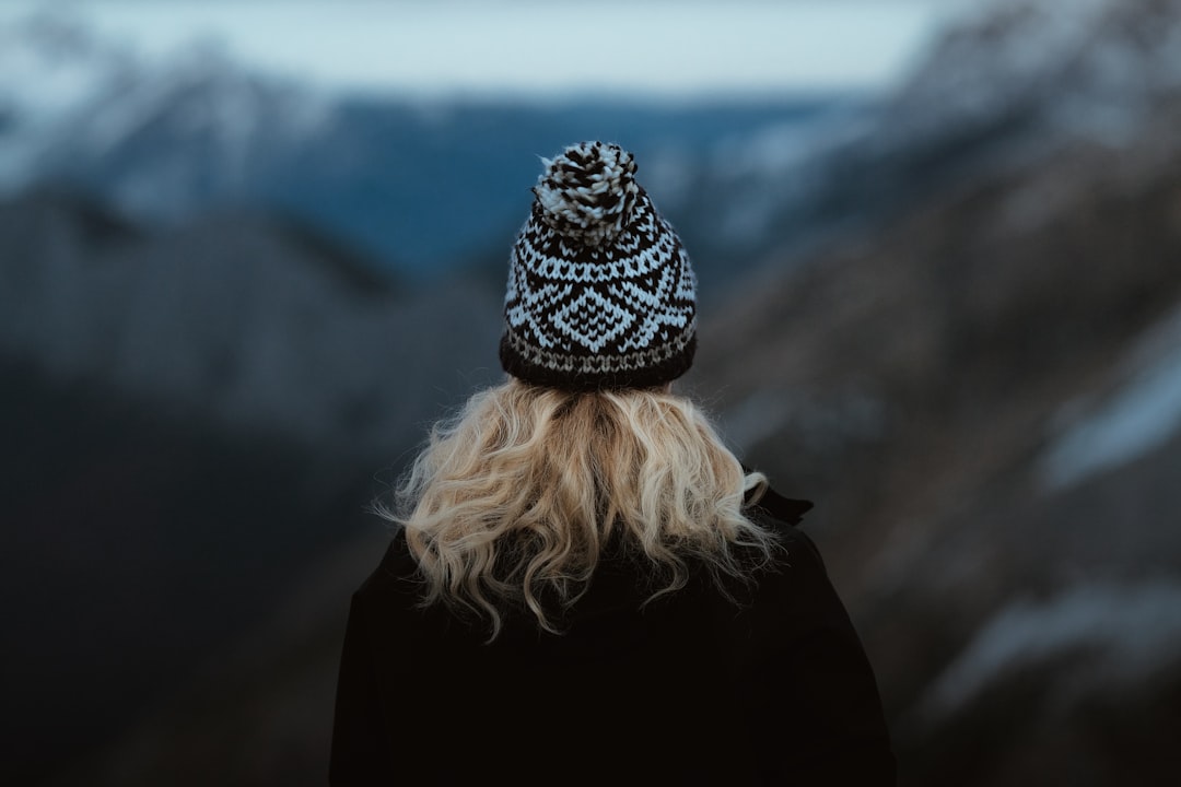 woman in black and white knit cap