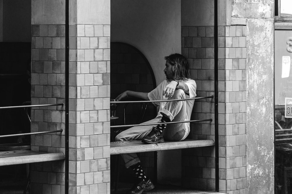 woman in white long sleeve shirt sitting on stairs