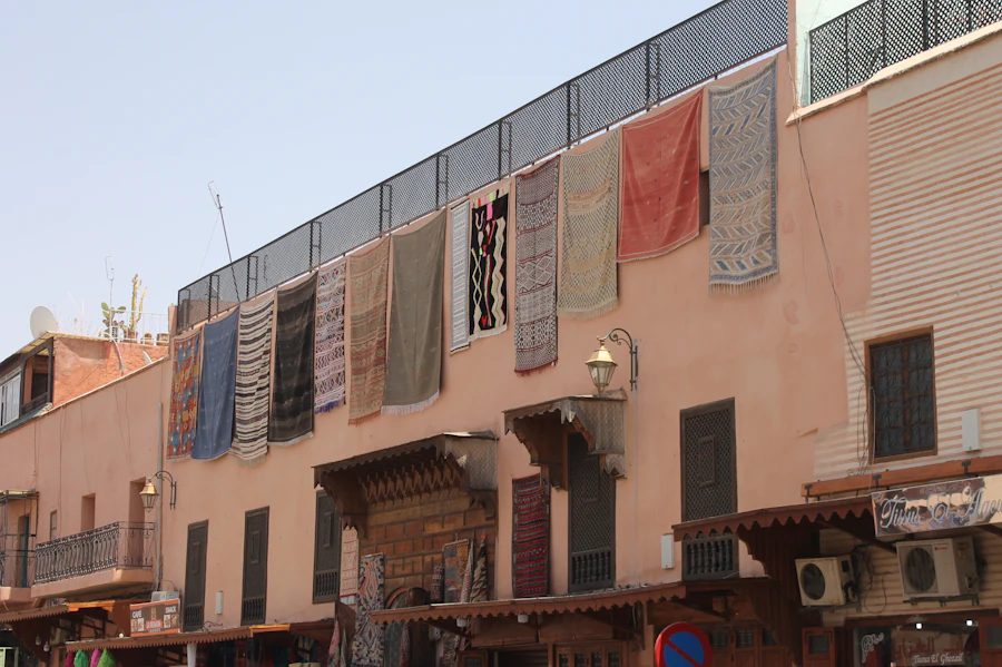 Traditional rugs hanging from a Marrakech medina rooftop terrace