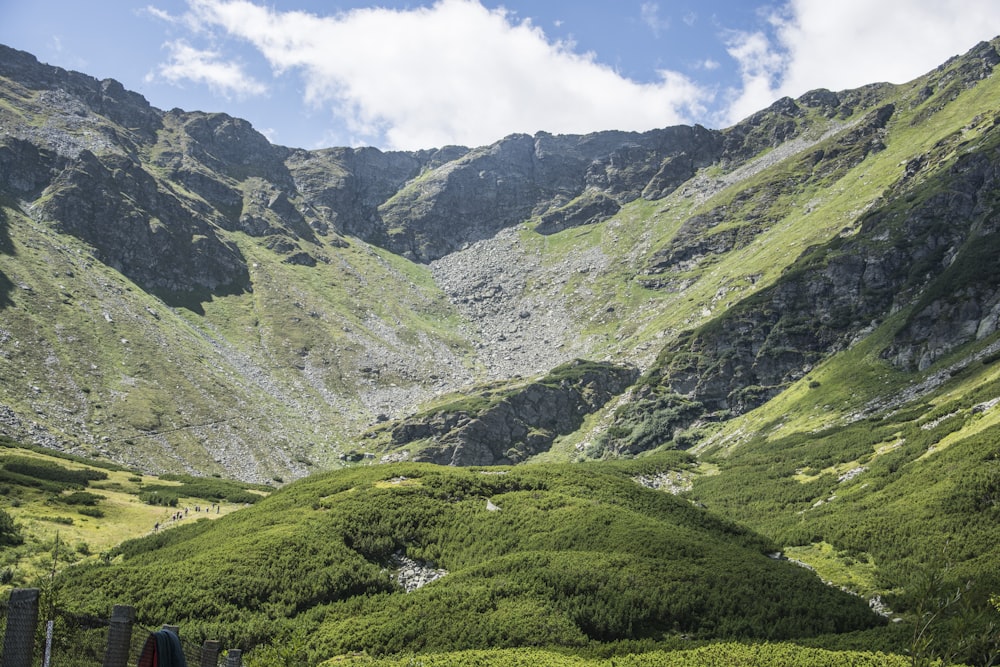 green mountains under white clouds during daytime