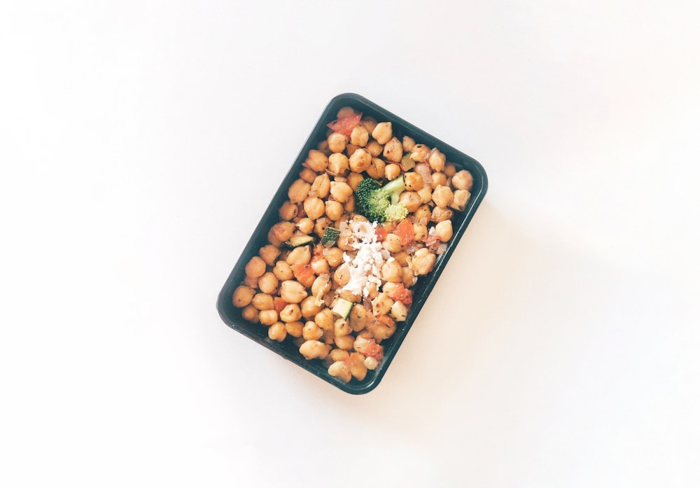 brown and white food in blue plastic container