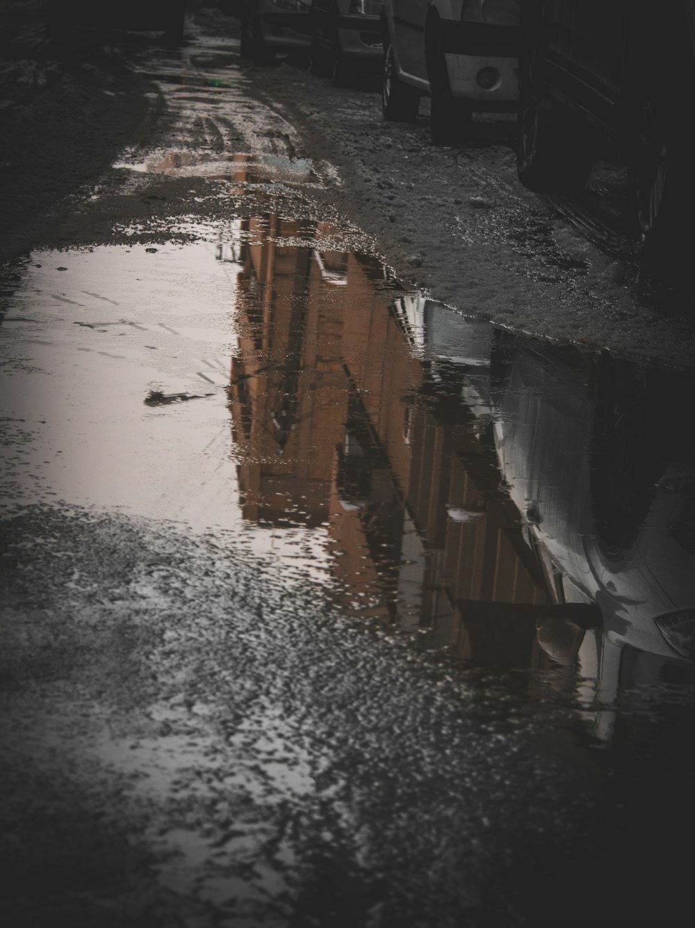 water droplets on brown wooden wall