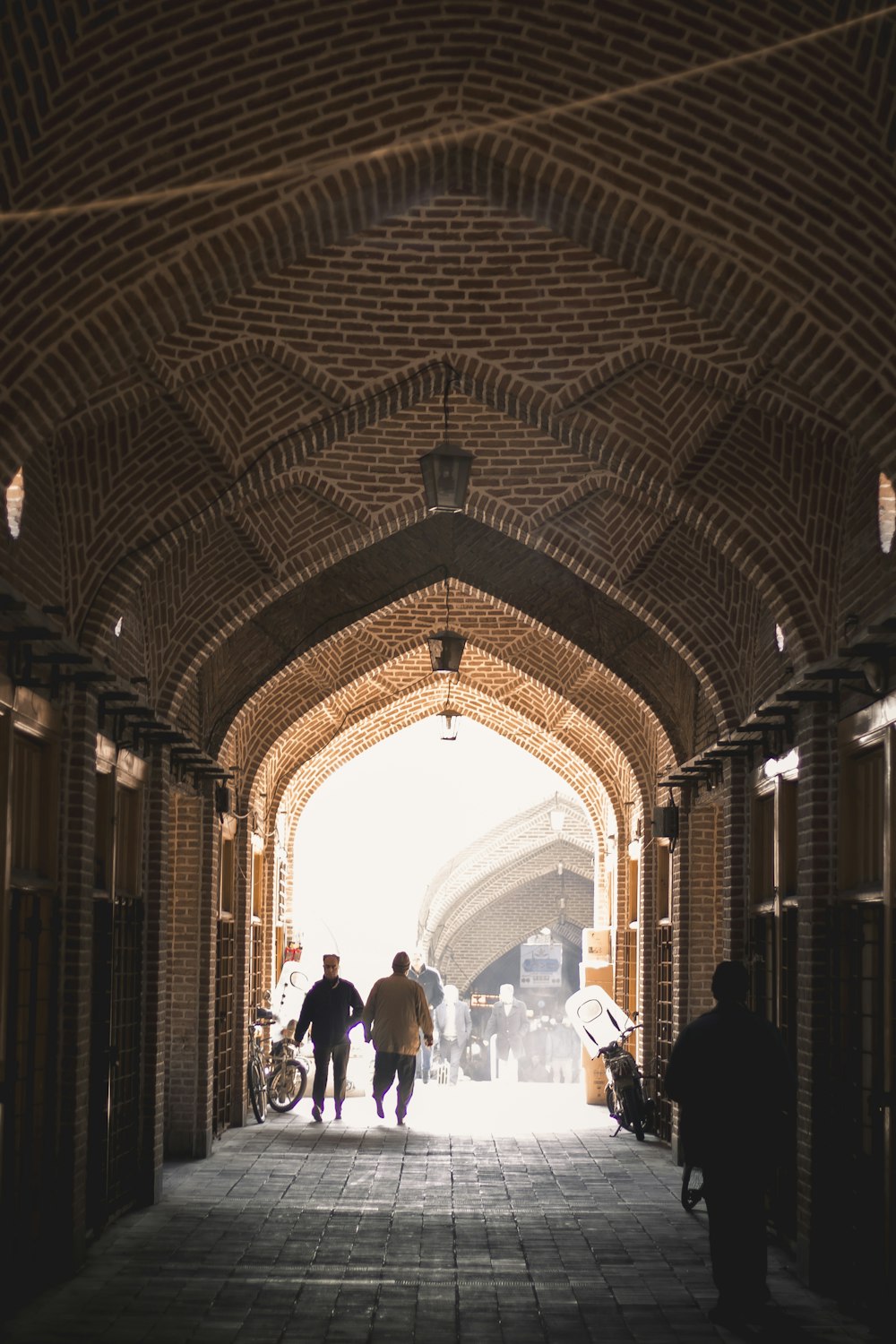 people walking inside brown building