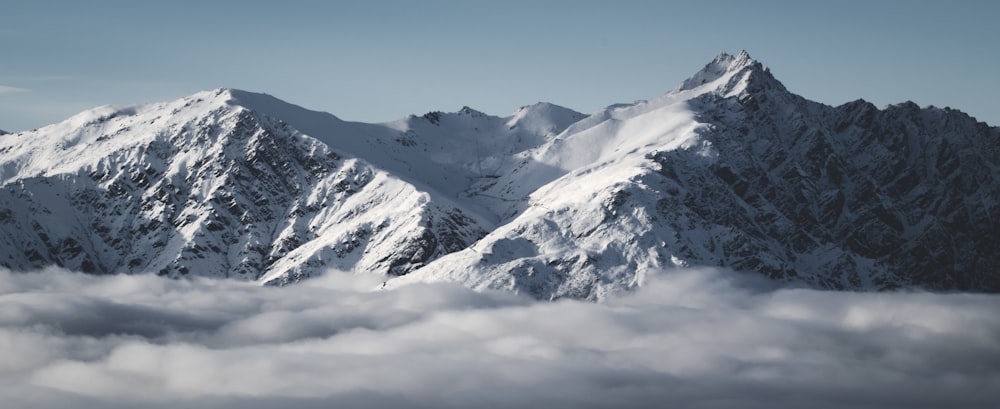 snow covered mountain under blue sky during daytime