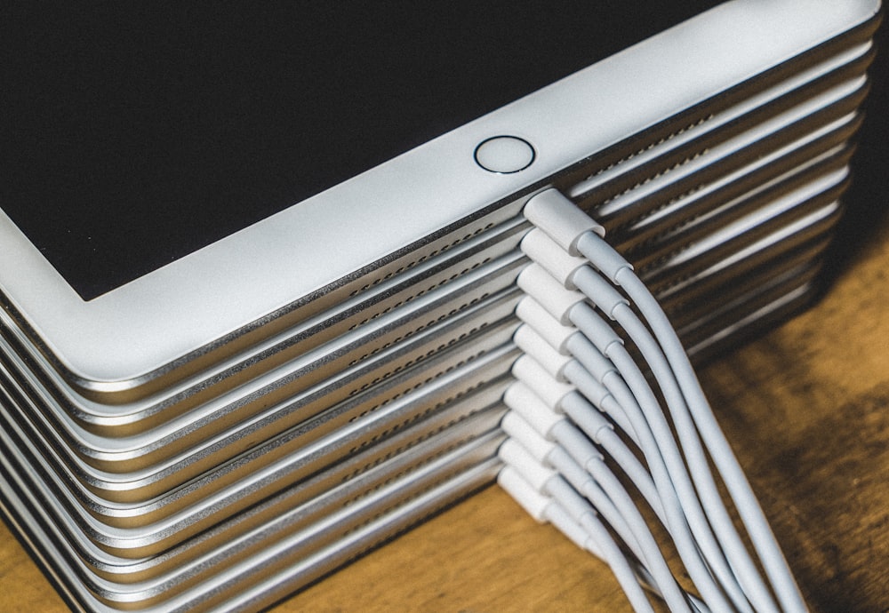 silver imac on brown wooden table