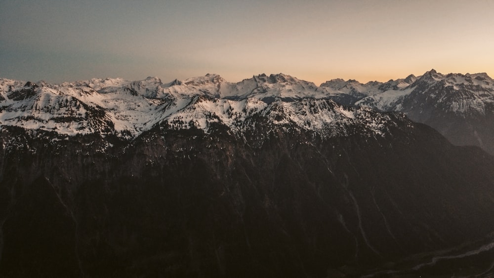 snow covered mountain during daytime