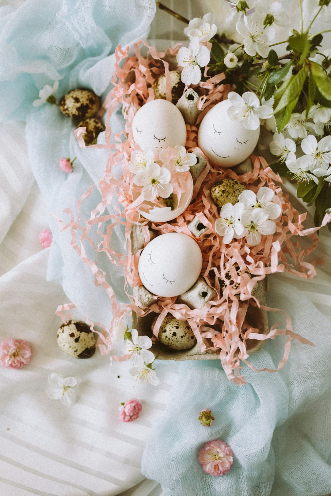 white egg on white and pink floral textile