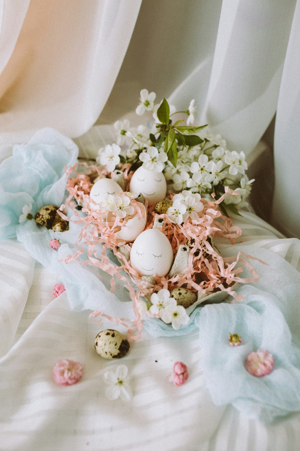 white and pink flowers on white textile