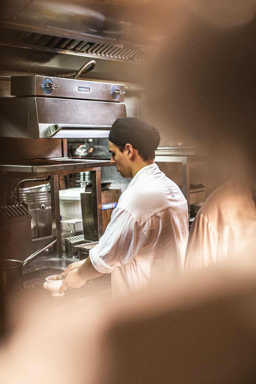 man in white shirt cooking